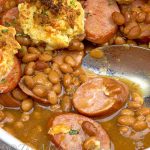 Jazzed up beans and tasty kielbasa form the base and topped off with delicious cheddary biscuits