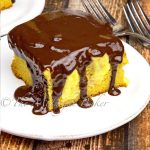 This Boston cream poke cake has layers of pound cake, creamy vanilla pudding and is topped off with a rich yet easy chocolate ganache.