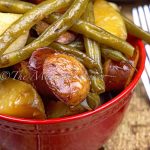 Kielbasa, green beans and potatoes come together to make this tasty and simple casserole. Dump it all in your slow cooker set it and forget it!
