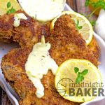 Pork chops with a crunchy seasoned crust made even better with a cheesy and lemony herb gravy