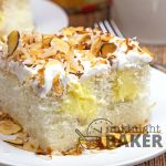 Toasted almonds and velvety coconut cream flavor this doctored poke cake.
