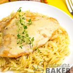 chicken in butter sauce on plate of buttery orzo