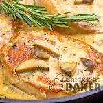 Pork chops cooked with a savory rosemary and mushroom sauce. Quick and easy skillet dinner!