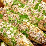 What a great way to serve corn! Mexican Street Corn is grilled then covered in a wonderful creamy crema enhanced by chili and cotija cheese.