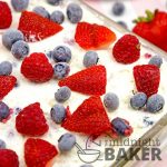 A truly patriotic dessert! Red raspberries, strawberries and blueberries mixed together in a white chocolate creamy filling separated by thin chocolate wafers