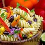 Delicious pasta salad and dressing with a southwestern taste. May also be eaten as a main course.