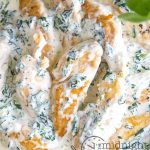 Tender chicken breasts cooked in a basil garlic cream sauce. Add spinach and it's a complete meal in just one pan