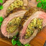 Easy and elegant stuffed flank steak is perfect for holiday parties or any time!